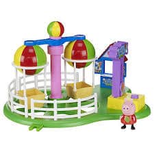 A colourful toy set featuring a mini Ferris wheel with two red, green, and yellow gondolas, surrounded by a white fence. A small ticket booth stands nearby, and a Peppa Pig character figure is included on a green base.