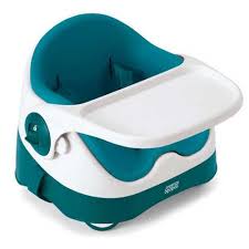 A blue and white booster seat with a high back and rounded armrests, featuring a detachable white tray in front. The seat has safety straps on the sides and bottom, designed for young children to sit at a table.