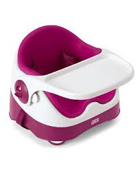 A modern booster seat for babies and toddlers with a white tray, pink seat, and pink base. The tray is attached to the front, and the chair has a high back for support. The design is rounded and smooth, suitable for feeding or playtime.