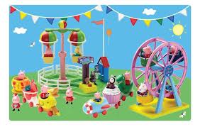 Colourful illustration of a toy amusement park with Peppa Pig characters. Features a Ferris wheel, merry-go-round, bumper cars, and a toy train. Bright blue sky, sun, clouds, bunting, and green grass create a festive, playful scene.