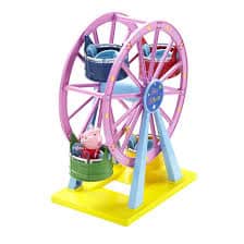 A colourful toy Ferris wheel with a yellow base, purple wheel, blue supports, and three seats—green, blue, and red. A small pink cartoon pig figurine sits in the green seat, inspired by the children's show Peppa Pig.