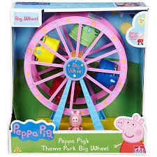 A boxed toy set featuring a pink Ferris wheel with colourful cabins, labelled “Big Wheel,” from Peppa Pig. Peppa Pig stands in front of the wheel, and the packaging is decorated with Peppa Pig graphics and the text “Peppa Pig’s Theme Park Big Wheel.”.