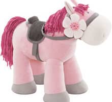 A pink stuffed horse with a saddle.