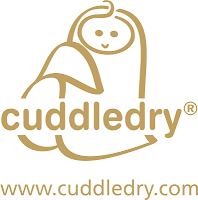 A gold outline logo showing a smiling, wrapped baby, resembling a towel or blanket. The word “cuddledry” is written in lowercase, rounded letters below. At the bottom is the website: www.cuddledry.com, all in matching gold.