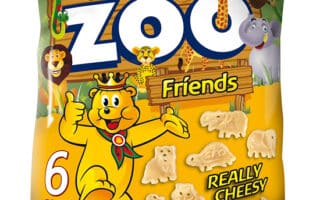 A yellow bag of Pom-Bear Zoo Friends snacks, featuring cartoon zoo animals and a bear mascot on the front. The packaging says “Really Cheesy,” advertises gluten-free and no artificial additives, and contains 6 packs. Shaped snacks are shown on the bag.