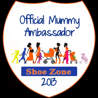 A white badge with an orange outline reads “Official Mummy Ambassador Shoe Zone 2013.” Below the text are silhouettes of women, children, and pushchairs in various colours, representing mothers and kids.