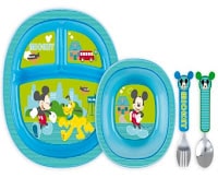 A blue children’s plate with three sections, a matching bowl, fork, and spoon. All have images of Mickey Mouse and Pluto on a green background, with additional designs of hearts, a bus, and buildings. Fork and spoon handles feature Mickey Mouse faces.