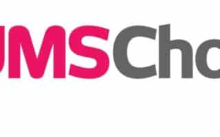 Logo with the words "MUMS' Choice" on a white background; "MUMS'" is in bold pink letters and "Choice" is in bold grey letters, with both words in a modern, sans-serif font.