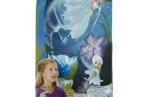 Packaging for Disney Fairies "Sky High Periwinkle" toy. The box features a Periwinkle fairy doll with translucent wings, a blue flower launcher, and artwork of Periwinkle flying. A young girl smiles and holds the launcher at the bottom left.