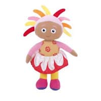 A plush doll with brown skin, wide eyes, and colourful felt hair in yellow, pink, and red spikes. The doll wears a pink top with red flower patterns, a white petal-like skirt over a red base, yellow legs, and purple and pink shoes.