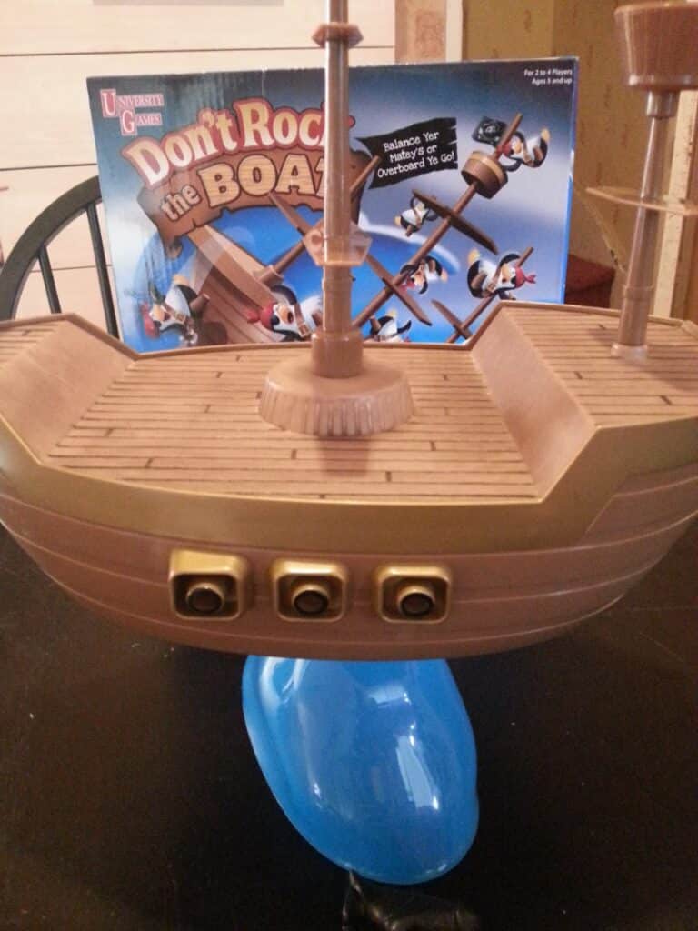 A toy ship on a table.