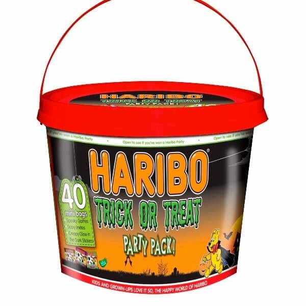 A bucket with a red lid and handle, labelled "Haribo Trick or Treat Party Pack." The bucket features Hallowe’en-themed graphics, including a pumpkin and a cartoon bear, and advertises “40 mini bags of gummy sweets.” The background is black and orange.