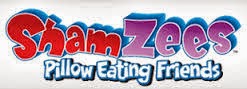 The image shows the "ShamZees Pillow Eating Friends" logo. "ShamZees" is written in large, playful red and purple bubble letters, whilst "Pillow Eating Friends" appears underneath in smaller, blue letters. The background is white.