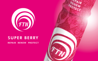 A bright pink advert features a bottle labelled "FTN Super Berry" with white spirals, berry illustrations, and the words "Repair, Renew, Protect." Next to the bottle is the FTN spiral logo and slogan, all set against a vivid pink background.