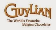 The image shows the Guylian logo in gold-brown letters with the tagline "The World's Favourite Belgian Chocolates" written in a smaller serif font below it, all set against a plain light background.