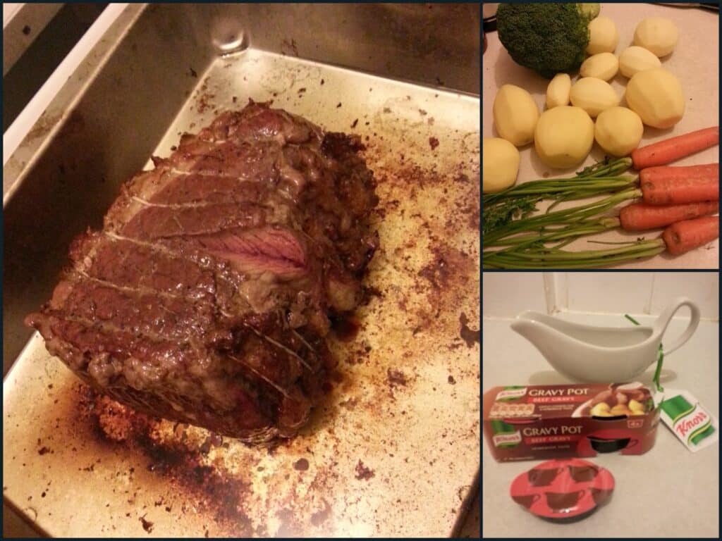 A roasting tin with a cooked roast beef, whole potatoes, carrots, and broccoli on a worktop, and a gravy boat beside two Knorr Gravy Pot packs, one with its lid off, showing the gravy inside.