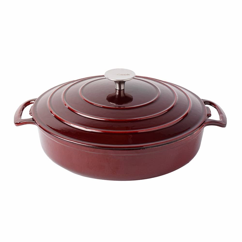 A deep, round, dark red enamelled cast iron casserole dish with two side handles and a matching lid. The lid has concentric ridges and a silver knob on top. The dish sits on a white background.