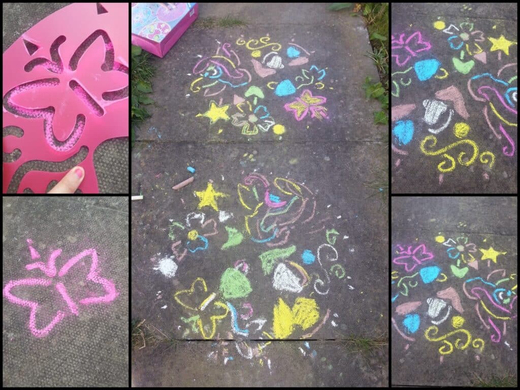 A collage shows a pink butterfly stencil, chalk-drawn butterfly on pavement, and colourful pavement chalk art on concrete, featuring butterflies, hearts, stars, flowers, and swirls in yellow, pink, blue, and green. Grass borders some edges.