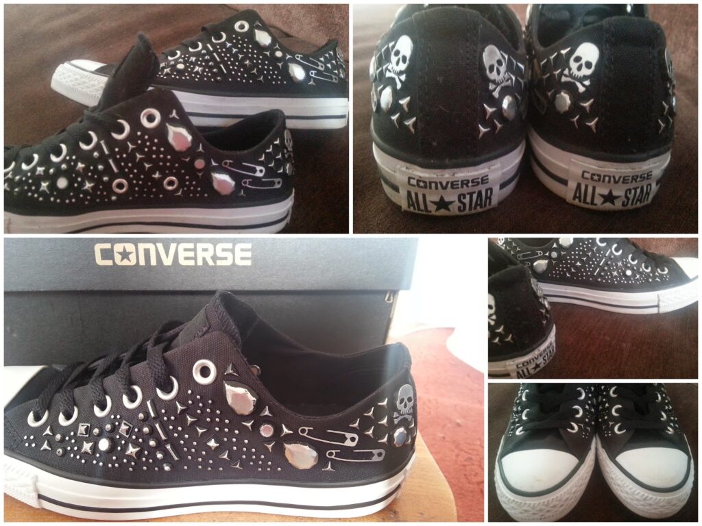 A collage of five photos shows black Converse All Star trainers decorated with metal spikes, studs, safety pins, and skull designs. The shoes are displayed from various angles, including side, back, and top views, next to a Converse box.