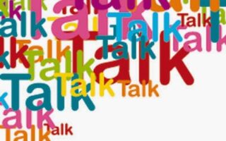The image shows the word “Talk” repeated in various sizes, fonts, and colours, overlapping each other. The background is white, and the vibrant colours include red, pink, blue, green, orange, and yellow.