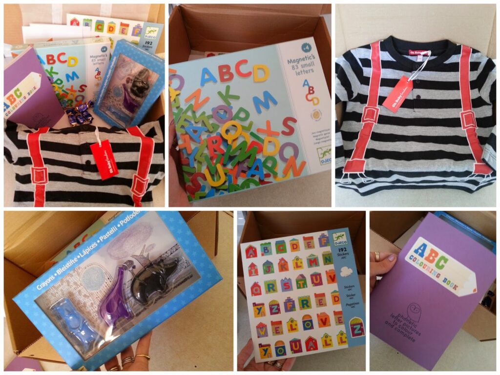 A collage shows educational items: magnetic letters, alphabet books, activity packs, a striped shirt with red braces, and a purple colouring book titled "ABC Colouring Book," all arranged in open boxes or displayed on a table.