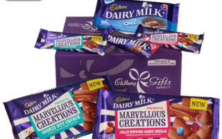 A selection of Cadbury Dairy Milk chocolate bars, including Oreo and Marvellous Creations flavours, is arranged in front of a purple Cadbury Gifts box. Each brightly coloured chocolate wrapper is labelled "NEW!" with images of the chocolate pieces on the wrappers.