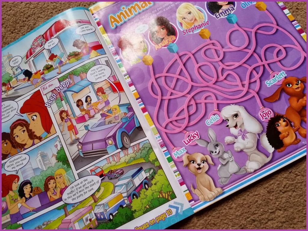 A children’s magazine page shows a comic of girls in a car at a drive-in restaurant on the left, and a colourful maze puzzle on the right. The maze connects four girls’ names to their cartoon pets: a kitten, a bunny, a poodle, and a brown dog.