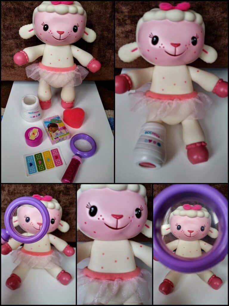 A stuffed lamb toy with a pink tutu and bow is shown with toy doctor accessories: plasters, bottle, magnifying glass, heart, and stickers. Close-up images highlight her face, bandaged leg, and the magnifying glass examining her face.
