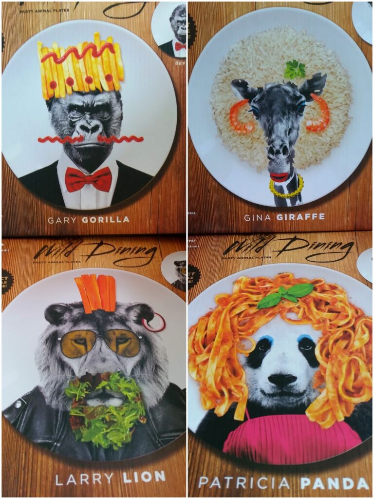 Four plates show animal faces made from food: a gorilla with chips as a crown, a giraffe with rice and carrot ears, a lion with pasta and lettuce mane, and a panda with spaghetti hair. Each plate has the animal’s name and a playful outfit.