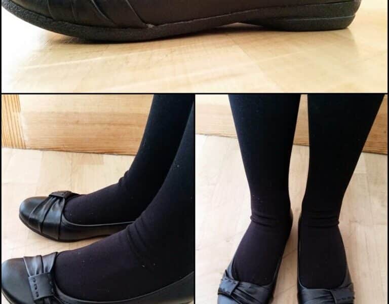 Three photos of black ballet flats with bows on the front, worn with black tights. The top image is a side view of one shoe, whilst the bottom two images show both feet from a top view and a side angle, all on a light wood floor.