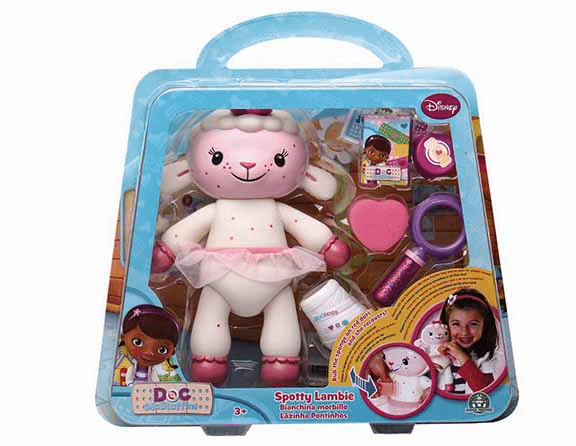 A boxed Doc McStuffins toy set featuring Spotty Lambie, a plush lamb wearing a pink tutu. The packaging includes toy accessories like a magnifying glass, heart-shaped box, and bottle. The Disney logo and pictures of Doc McStuffins and a child are on the box.