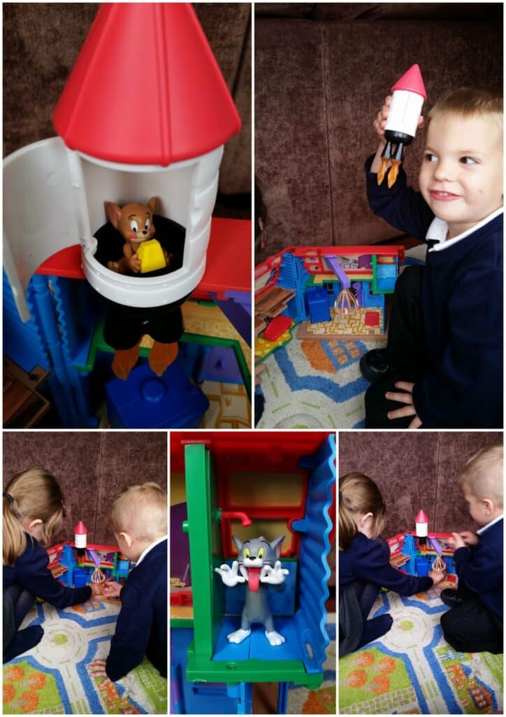 A collage shows two children playing with Tom and Jerry toys and a playset. Jerry sits in a red rocket, Tom is in a green compartment, and the boy holds a toy rocket. Both kids are engaged on a colourful carpet with playhouse pieces.