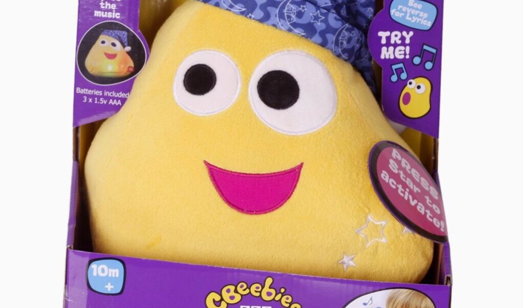 A yellow stuffed toy in a box.