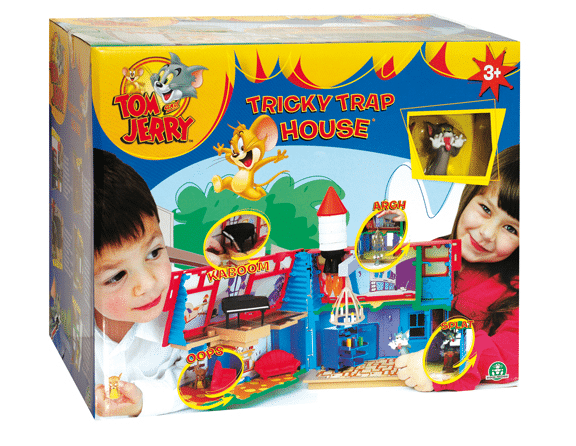 Colourful "Tom & Jerry Tricky Trap House" toy box for ages 3+, featuring images of a boy and girl playing, cartoon Tom and Jerry characters, trap features like “Kaboom!” and “Oops”, and a playful house toy inside.