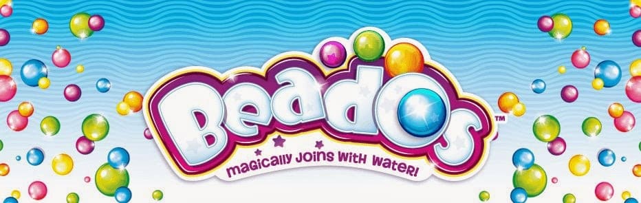 Colourful Beados logo with bubble-like letters, surrounded by vibrant, multicoloured beads and bubbles on a blue wavy background. Text below reads “Magically Joins With Water!” in a playful purple font.