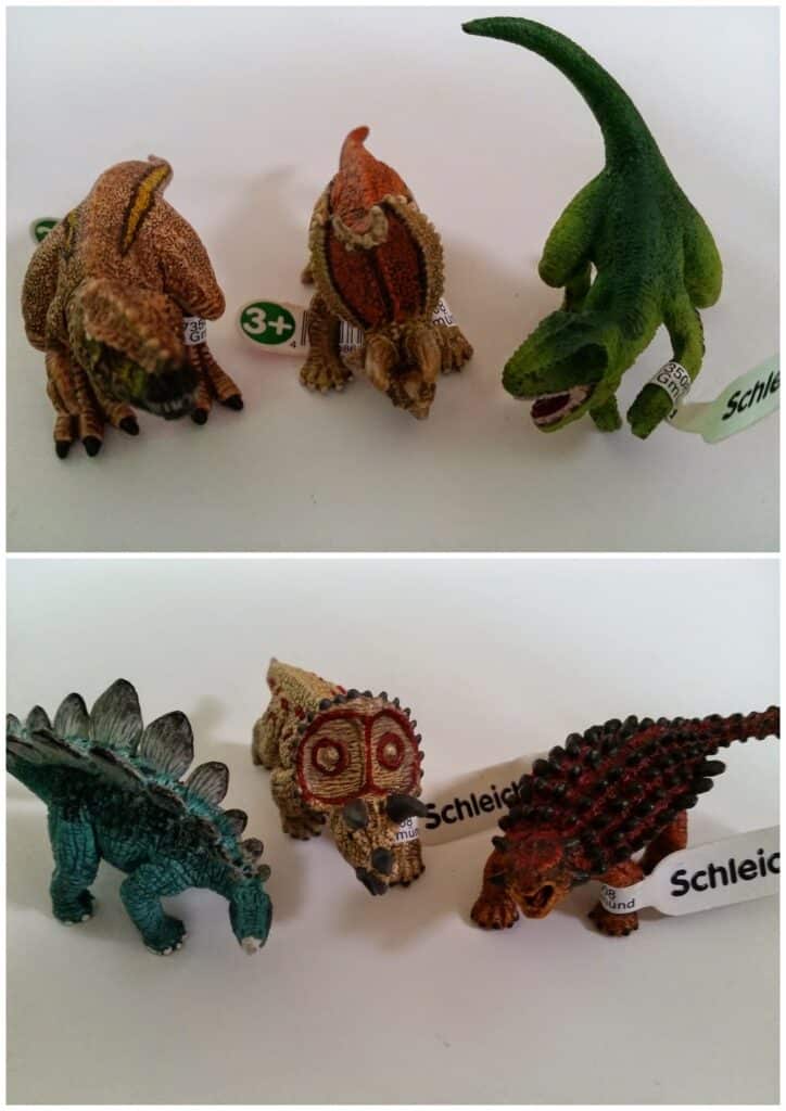 Two rows of small toy dinosaurs are shown on a white background. The top row has three brown and one green dinosaur. The bottom row has a blue stegosaurus, a brown ceratopsian, a brown dinosaur skull, and a brown ankylosaurus. Tags read "Schleich.