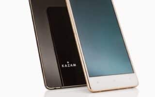 Two Kazam smartphones are displayed against a white background: one gold phone stands upright showing its front screen, while a black phone leans against it, showing its reflective back with the Kazam logo and a single rear camera.