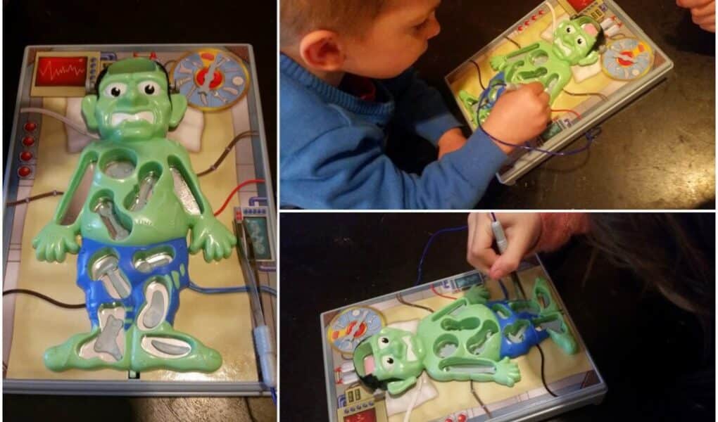 Three photos show a green Frankenstein-themed Operation board game. One image shows the game board close-up, the others show children playing, using tweezers to remove plastic body parts from shaped cavities in the character’s body.