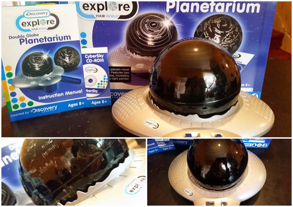 A Discovery Explore Double Globe Planetarium sits on a table. The device is grey with a black dome and is displayed with its box, an instruction manual, and a CyberSky CD-ROM. Close-up shots show star patterns and constellation labels on the dome.