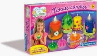 A colourful craft kit box labelled "Nature Candles" features images of decorative homemade candles, a smiling girl holding a green candle, and text highlighting the use of natural materials. The box is mostly pink with vibrant candle photos and the Clementoni logo.