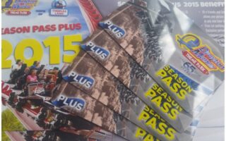 Several Drayton Manor Theme Park 2015 season pass cards fan out across a brochure. The brochure features the Drayton Manor logo, "2015 Season Pass Plus," and an image of people riding a rollercoaster. The cards display the park logo and "PLUS SEASON PASS" text.