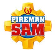 The image shows the "Fireman Sam" logo with bold white and red letters on a blue circle, surrounded by a yellow gear shape. At the top, there is a red and yellow flame symbol inside a small circle.