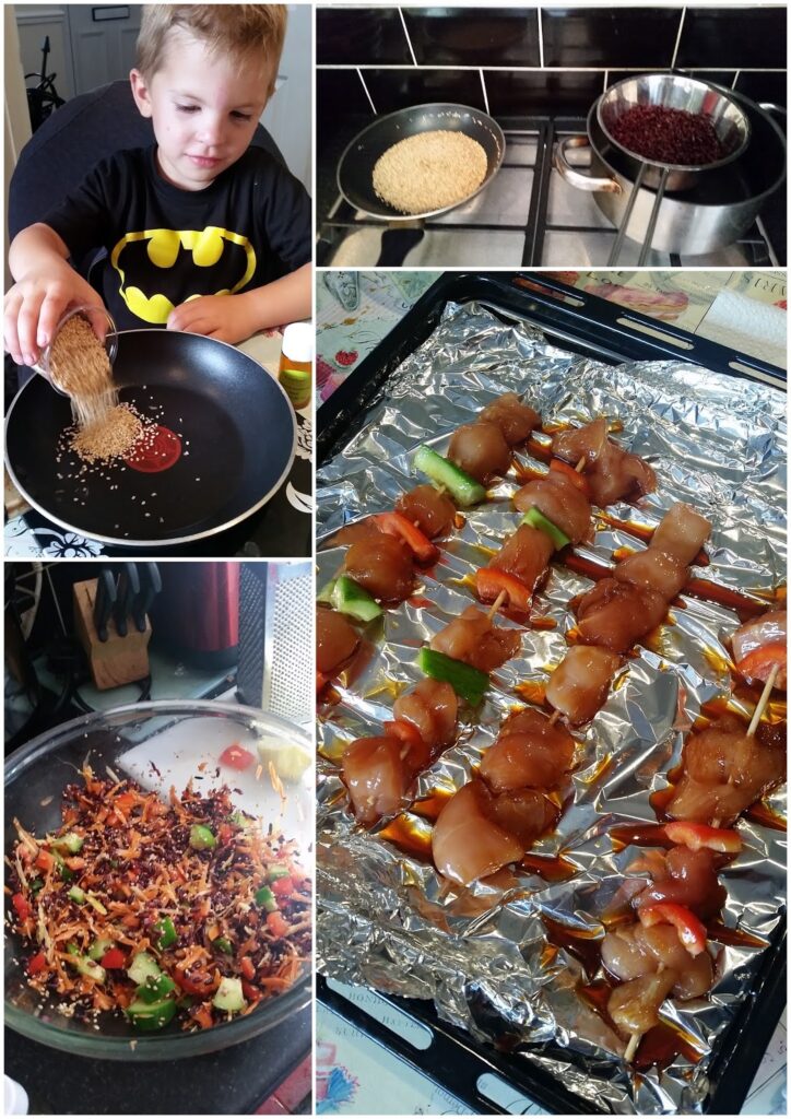 A collage shows: a boy in a Batman shirt pouring seeds into a frying pan; rice and black beans cooking on a hob; chicken and vegetable skewers on a foil-lined tray; and a wok with cooking veg, shredded carrot, and grains.