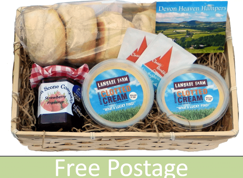 A wicker hamper contains scones, a jar of strawberry preserve, two tubs of Langage Farm clotted cream, two small knives, and a Devon Heaven Hampers leaflet. The base of the image has a green banner with the text “Free Postage”.