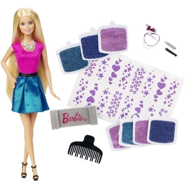 A Barbie doll with long blonde hair wears a pink top and metallic blue skirt. Around her are sheets of purple stickers, glittery hair chalks in blue and purple, a pink Barbie bar, a black comb, and small hair accessories including clips and hairbands.
