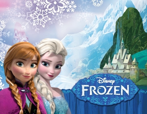Anna and Elsa from Disney’s Frozen stand side by side, smiling, with snowflakes and icy mountains in the background. A castle sits atop a mountain, and the Disney Frozen logo appears in the lower right corner. The scene has a magical, wintry feel.