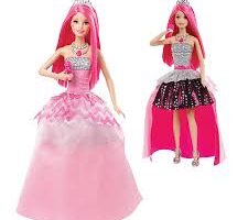 Two fashion dolls with long pink hair, wearing silver tiaras. Both wear sparkly silver tops; one doll has a full pink ball gown with a gemstone necklace, while the other wears a high-low pink and black polka dot skirt and silver heels.
