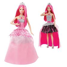 Two fashion dolls with long pink hair, wearing silver tiaras. Both wear sparkly silver tops; one doll has a full pink ball gown with a gemstone necklace, while the other wears a high-low pink and black polka dot skirt and silver heels.