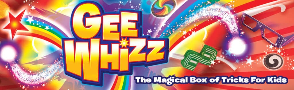 Colourful, dynamic image with "GEE WHIZZ" in large yellow and red letters, surrounded by rainbows, stars, and sparkles. At the bottom, white text on blue reads "The Magical Box of Tricks For Kids." Various magic trick props are scattered around.