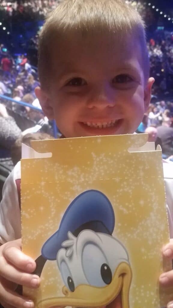 A boy smiling at the camera.